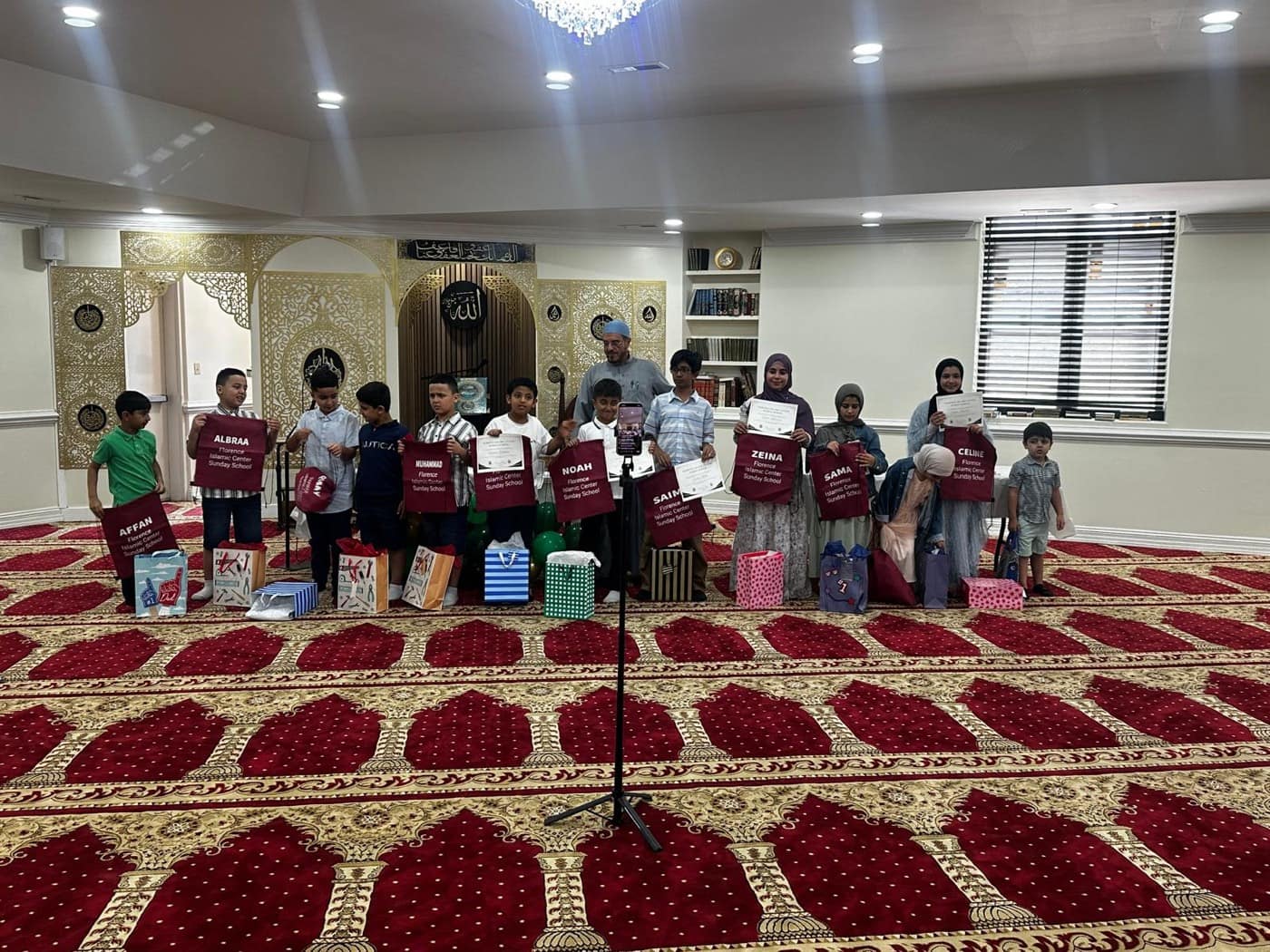 Sunday School children holding their end-of-year certificates